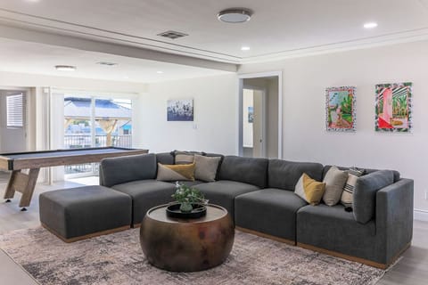 Gather, unwind, and connect in the spacious living room with ample seating.