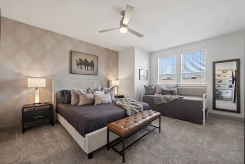 Main Bedroom: Spacious bedroom with king bed, cozy décor, and extra seating—designed for comfort and relaxation.