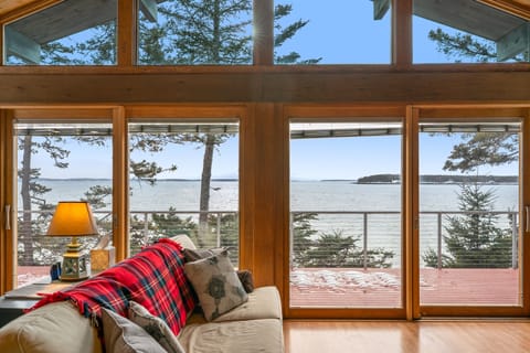 Your front-row seat to the North Atlantic. This soaring cathedral living space features a full wall of glass, framing unobstructed western views of Bass Harbor. Step onto the deck and experience the Quiet Side’s finest golden hour.