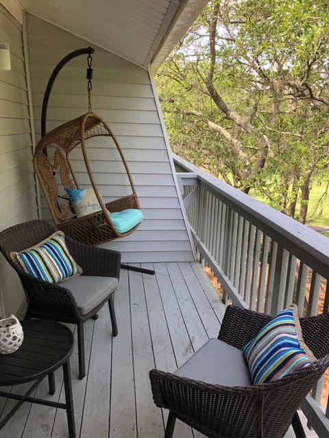 Relax on the “tree house” deck, nestled behind what looks a lot like a jungle!
