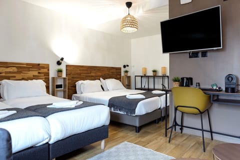 Family Suite, Multiple Beds | Premium bedding, laptop workspace, soundproofing, iron/ironing board