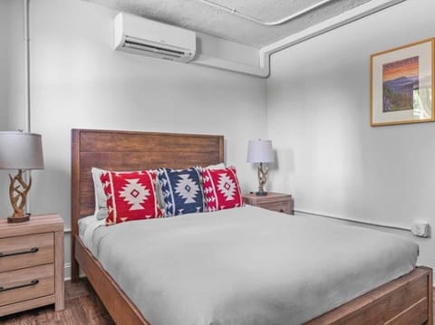 Bright, modern studio with a cozy queen bed, kitchenette, dining area, and smart TV—perfect for a comfortable and convenient stay.