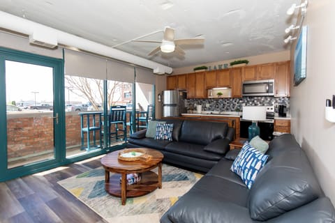 Relax in this stylish open-concept space where your living area flows seamlessly into a fully-equipped kitchen, perfect for unwinding after exploring.