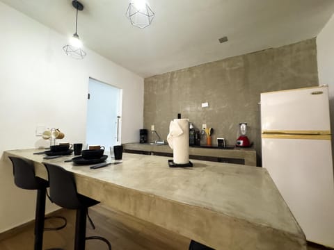 Sleek modern kitchen with spacious breakfast bar seating