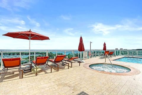 Rooftop pool and hot tub with ocean backdrop