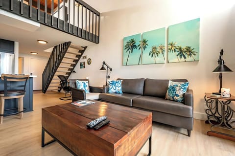 Soak up the sea from plush leather seating as palm prints, woven accents, and warm wood elevate every detail   NAP-C43