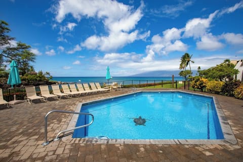  Where poolside calm meets patio bliss—relax in island elegance, just moments from the shoreline    NAP-A25