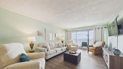 Open concept living area with stylish furnishings, gulf views, and sleeper sofa (sleeps 2)