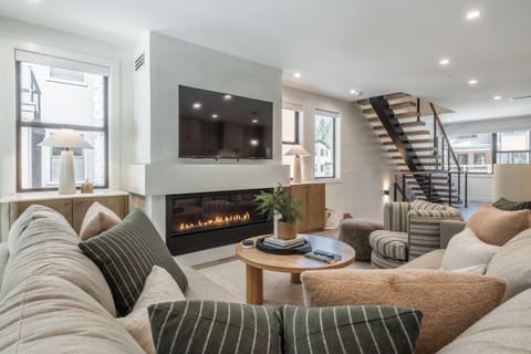 Living Room, Gas Fireplace,L Sectional Couch, Arm Chair, Private Deck, Game Seating area,65 smart flat screen tv