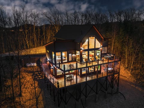 The Haven at Harvest Moon glowing at night — a private Smoky Mountain escape