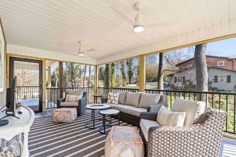 Spacious back deck with comfortable furniture.