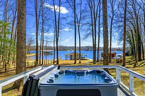 Hot Tub - Soak in the 7-person hot tub with lake views through the trees, just steps from the dock and sandy beach below.