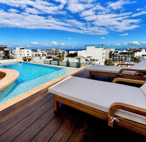 Relax poolside with comfortable lounge seating