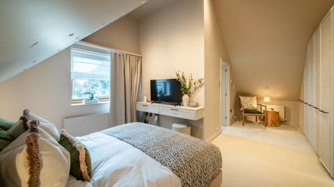 Bedroom 2 with king bed and vaulted ceiling character