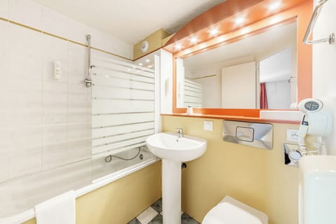 Bathtub, eco-friendly toiletries, hair dryer, towels