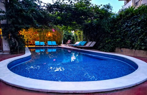 Seasonal outdoor pool, open 8:00 AM to 9:00 PM, sun loungers