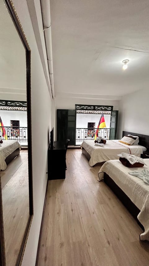 Standard Quadruple Room, Balcony, City View | Desk, laptop workspace, WiFi (free)