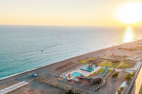 On the beach, sun loungers, beach umbrellas, beach towels