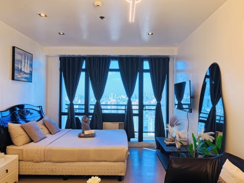 Comfort Condo, City View | Iron/ironing board, free WiFi