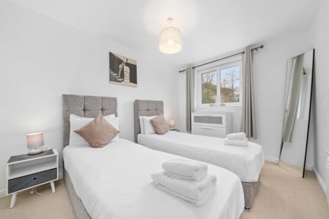 Twin Room: Bright and airy retreat with stylish beds and scenic views to refresh your stay!