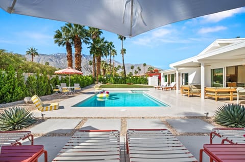 Dive into your private oasis where desert mountains frame crystal-clear waters and poolside loungers await your perfect vacation moments.