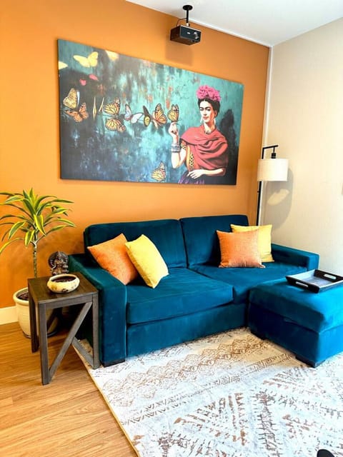 Colorful, Frida Kahlo inspired living room with projector
