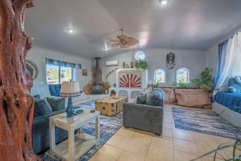 Iconic Adobe Living Room w/ Custom Sunburst Design, Fireplace & Cozy Seating