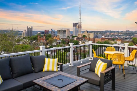 Relax and unwind on the spacious deck featuring a fire pit and outdoor furniture. With panoramic city views, it’s an ideal space to enjoy sunsets and starlit nights.