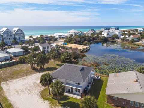 Coastal property positioned between pristine beach waters and tranquil lagoon, offering unique dual waterfront setting in established beachside neighborhood.