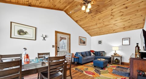 Cozy living and dining area with rustic wood accents