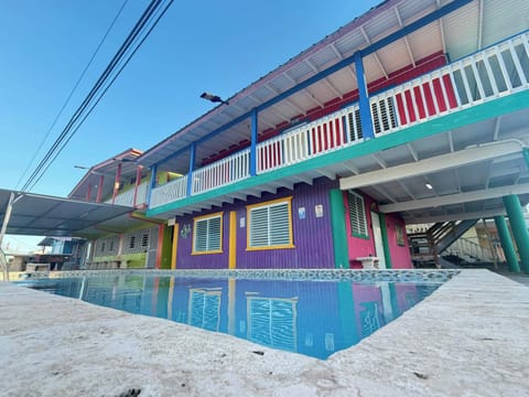 Welcome to your vibrant escape! Enjoy our colorful townhouse and refreshing pool.