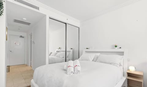 Cozy bedroom with mirrored wardrobe