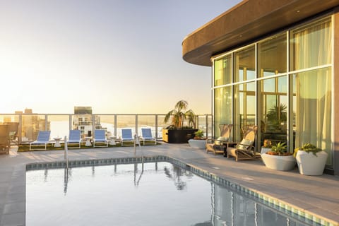 Experience the ultimate rooftop retreat with a sparkling shared pool and panoramic San Diego views.
