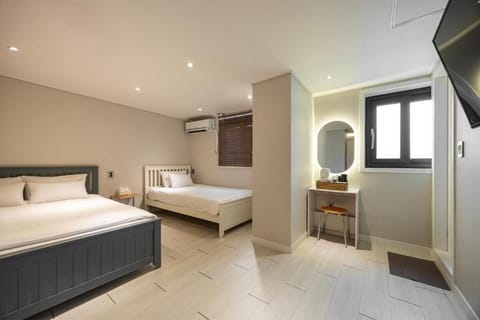Triple Room | Desk, laptop workspace, blackout drapes, iron/ironing board