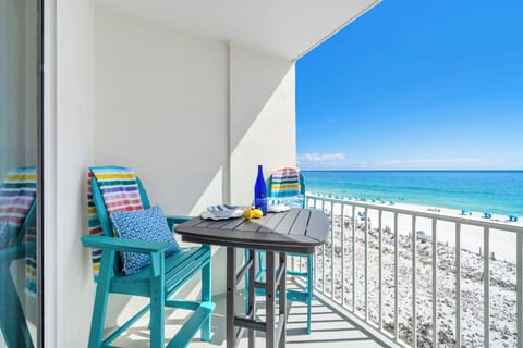 Sip your morning coffee on your private beachfront balcony, watching waves roll onto pristine white sand below.