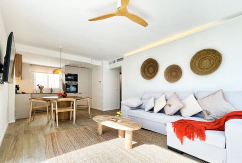 Bright living space with boho-Mediterranean décor, comfortable sofa and Smart TV for your evenings in Moraira.