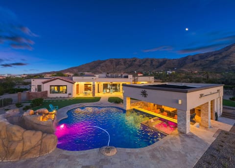 Luxury desert estate with glowing pool, spa, and sunset mountain views — your private Arizona retreat begins here ✨