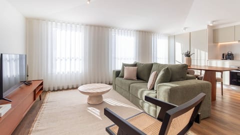 Contemporary living area with soft green hues and ample natural light, offering comfort and style.
#LivingRoom #ModernLiving #BrightSpace #InteriorDesign #PortoApartment