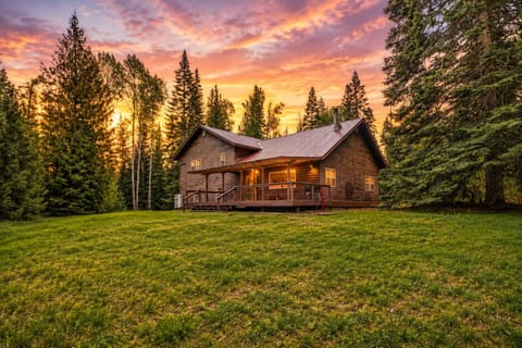 Tucked into the trees & glowing at sunset, Colburn Cabin is your private Idaho