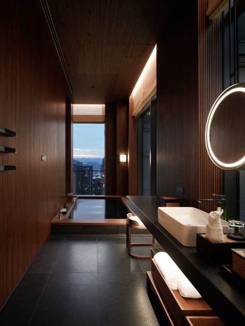 Suite, River View | Bathroom | Separate tub and shower, hair dryer, slippers, towels