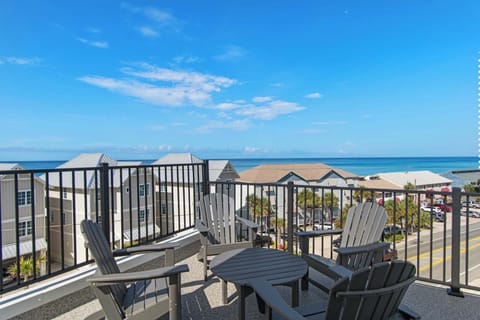 Unwind on your private balcony with Adirondack chairs and stunning ocean views stretching to the horizon.