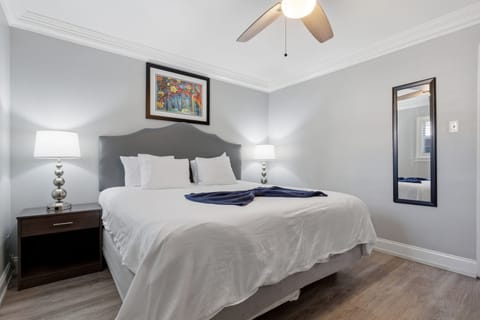 Crisp, cozy bed dressed in fresh white linens
