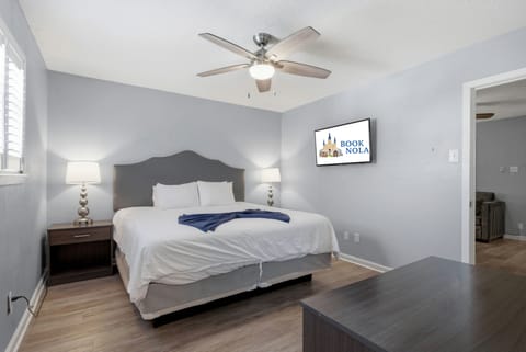 Serene primary bedroom with a king bed and a smart TV designed for restful nights