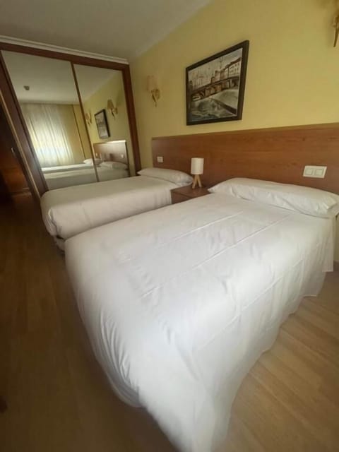 Twin Room, City View | Desk, blackout drapes, free WiFi