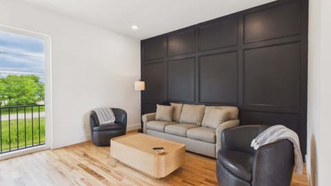 2nd Floor: Open concept living area with comfortable seating and TV + sleeper sofa (sleeps 2)