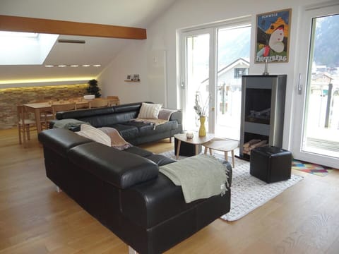 Furniture, Interior Design, Couch, Flooring, Wood, Floor, Living Room, Room, Lighting, Home