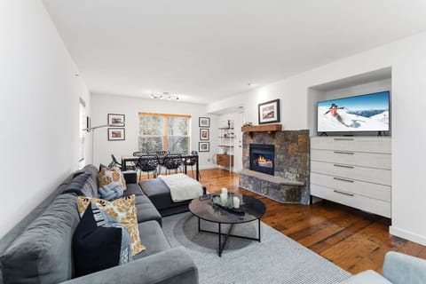 Cozy living room with smart TV and gas fireplace