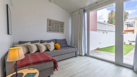 A cozy living room with large glass doors opens up to a small garden area.
#LivingRoom #CozyVibes #ModernDesign #InteriorDecor #MinimalistStyle #HomeComfort