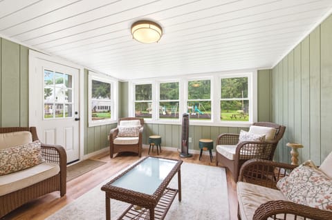 Playground views from the sunroom make it easy to keep an eye on family fun.