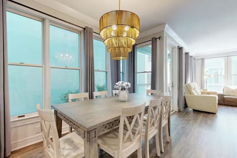 Gather around this elegant dining table where golden light creates the perfect ambiance for memorable meals with loved ones.